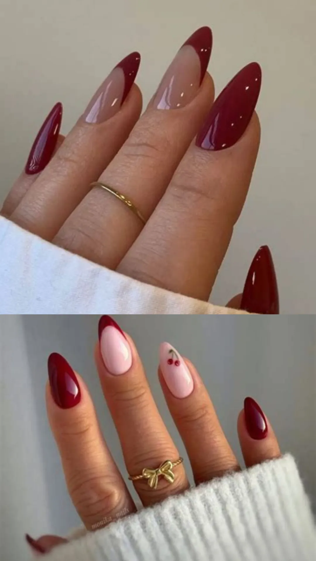 A two-part image showing minimalist and chic cherry red designs on long almond nails. The top image shows a hand with deep maroon-red tips forming an asymmetric French design alongside a solid maroon accent nail. The bottom image shows a hand wearing a small gold bow ring, featuring alternating solid dark red nails and light pink accent nails decorated with a tiny pair of painted cherries.